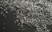 Transparent TPU granulate on black background Transparent TPU granulate on black background