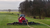 Modern agriculture: injection of liquid manure in grass land using a drag hose applicator Modern agriculture: injection of liquid manure in grass land using a drag hose applicator
